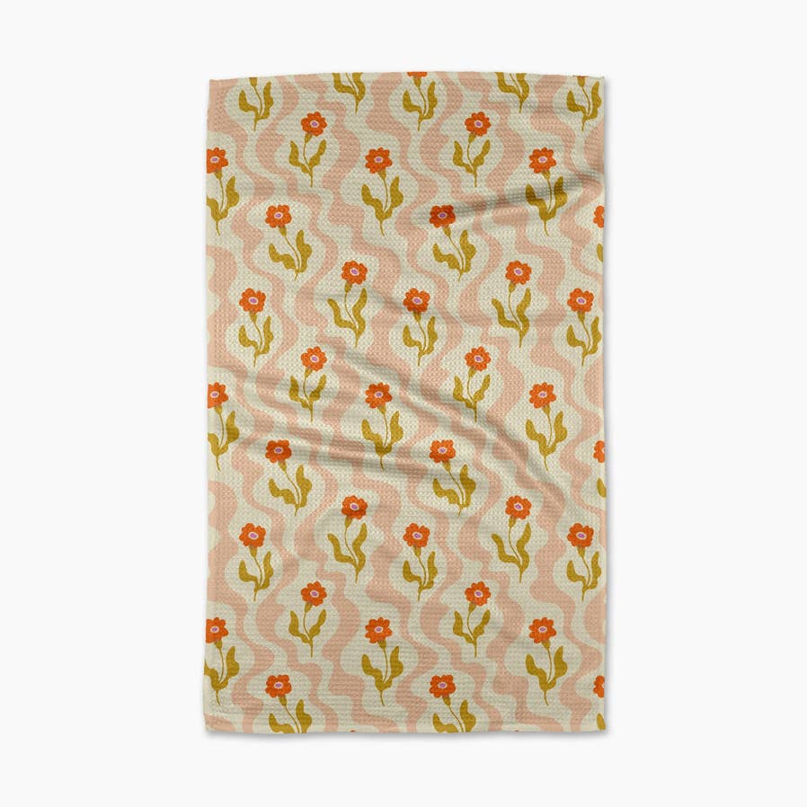 tan and blush squiggle towel with orange poppy flowers on it