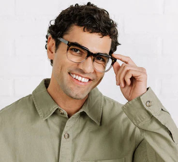 person wearing the front olive botanico grey crawford glasses