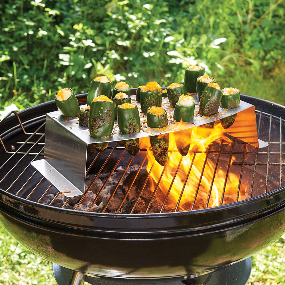 Grilling And Roasting Rack filled with stuffed zucchini and set on a hot grill