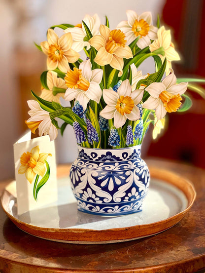 English Daffodils paper bouquet set on a table with its enclosure card.