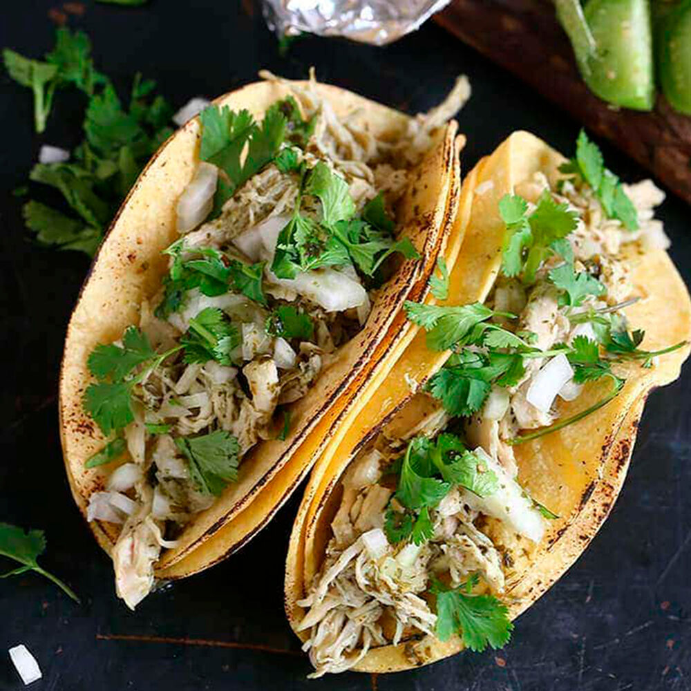 plate of tacos made with Tangy Tomatillo Garlic Taco Simmer Sauce.