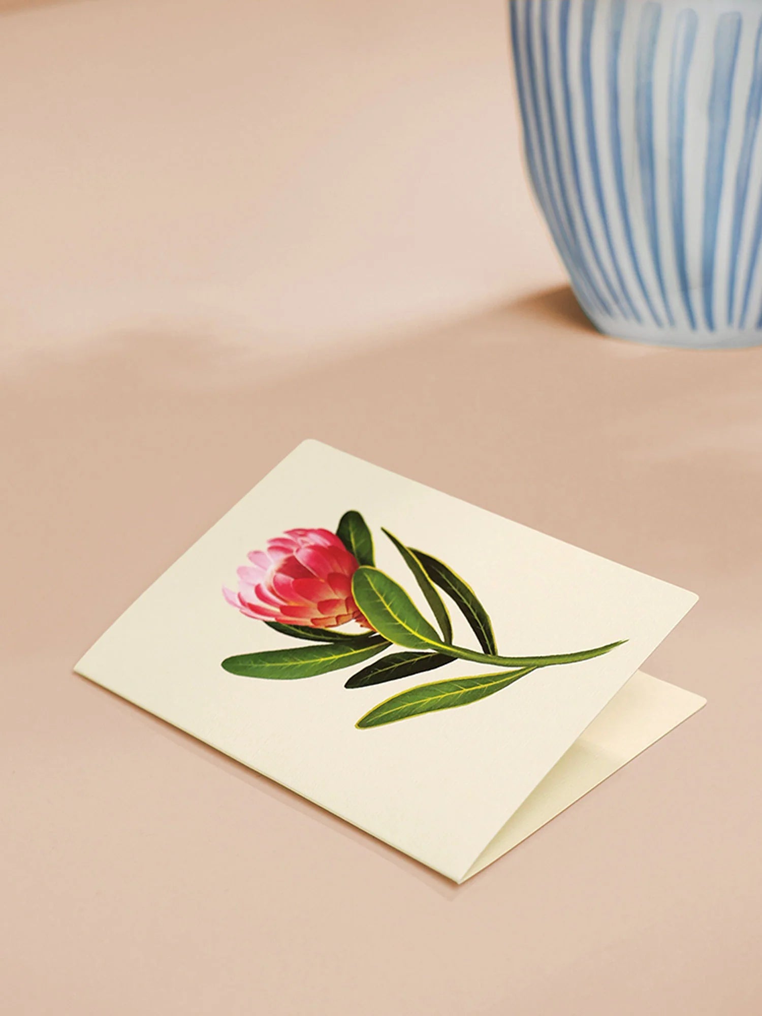 enclosure card for Tropical Paradise Pop-Up Bouquet with pink flower on it