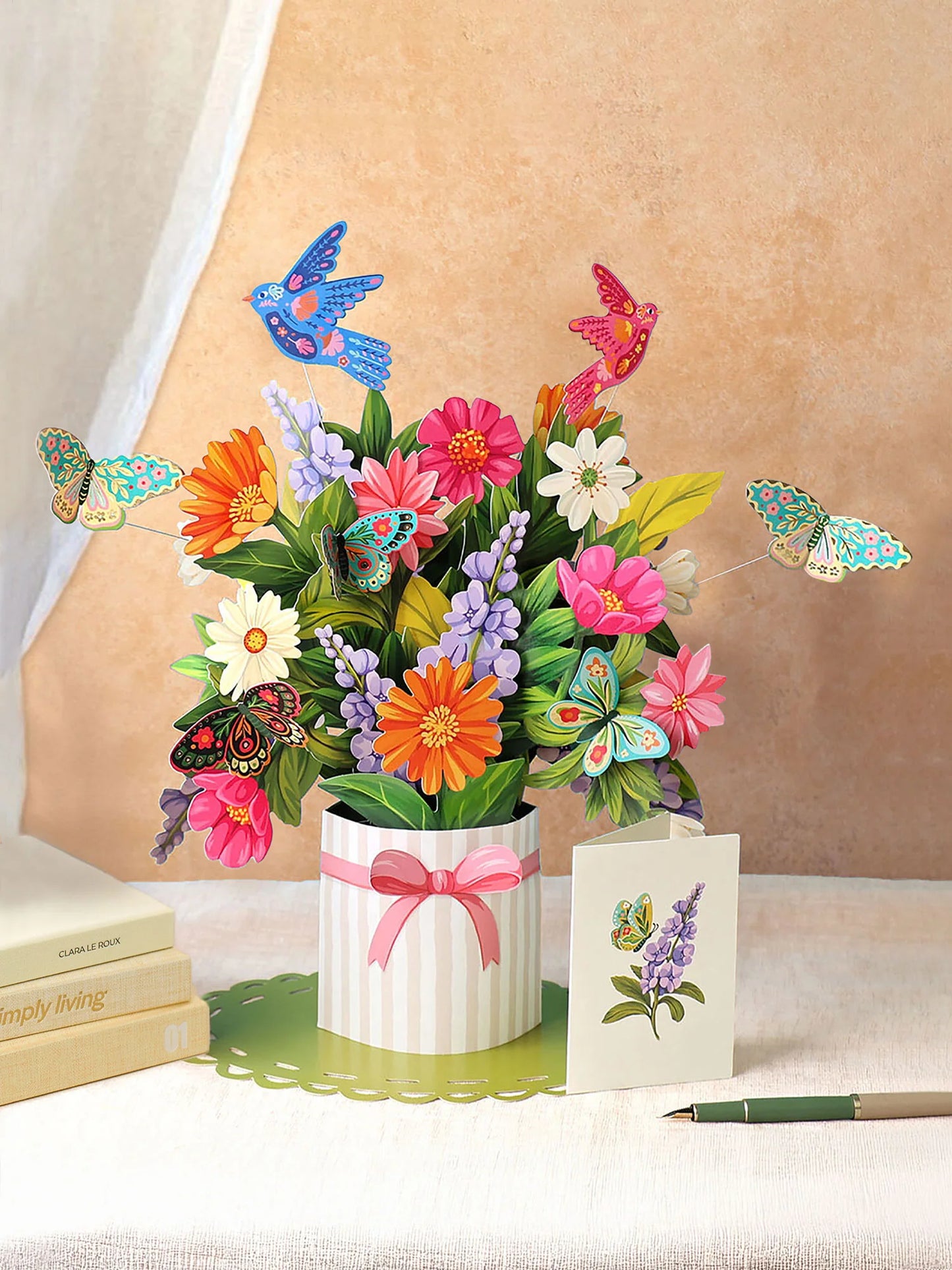 Enchanted Garden Pop-Up Bouquet made of colorful paper flowers with bird and butterflies fluttering above it