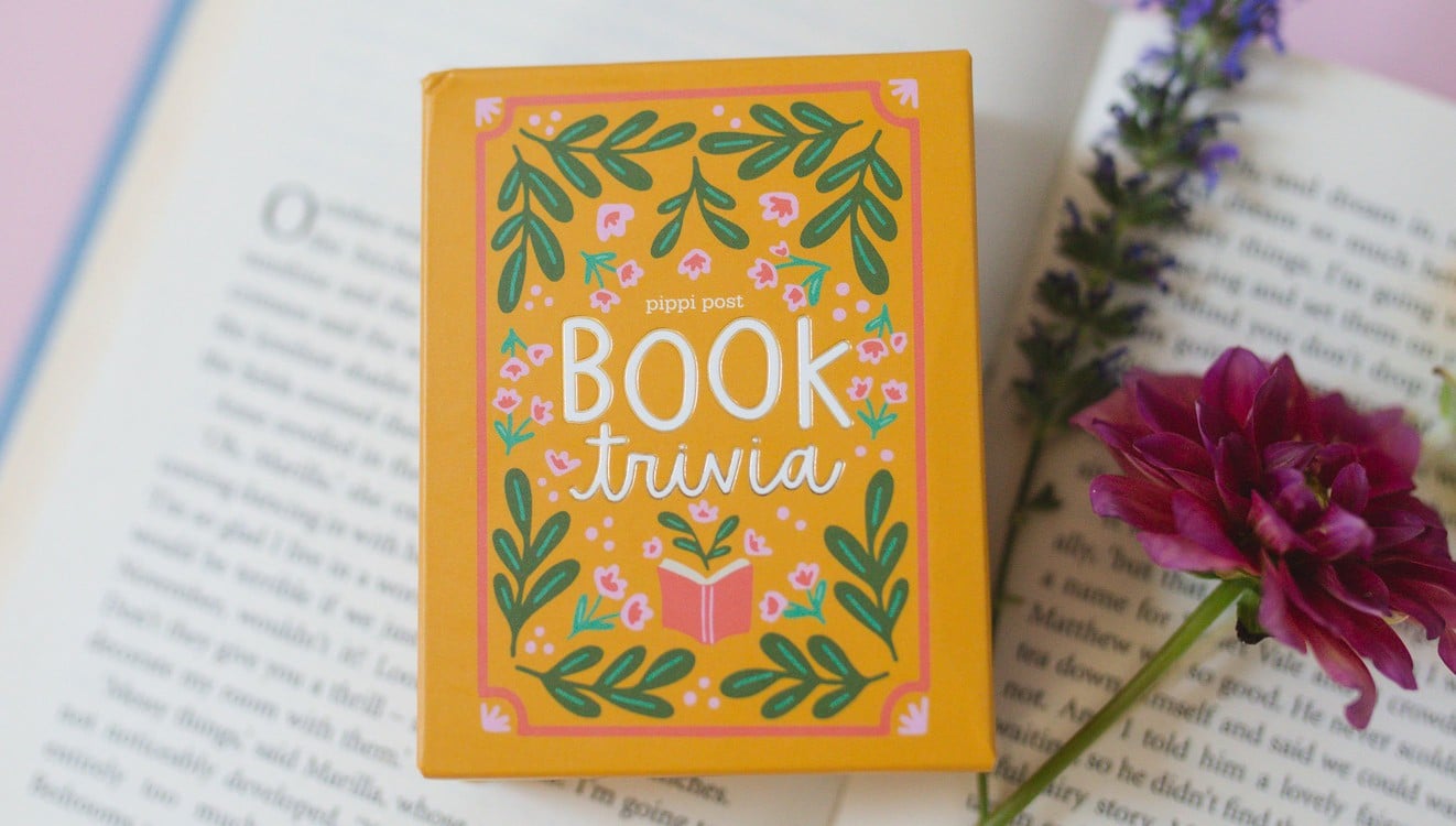 box of Book Trivia Card Set laying on an open book
