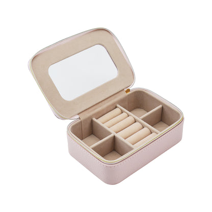 clear top Leah Travel Jewelry Case in pale pink unzipped showing multiple compartments inside