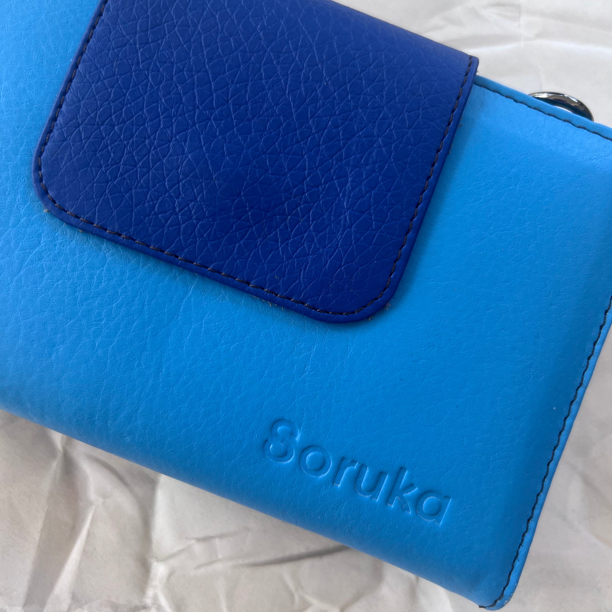 close-up of blue Beatrice Clutch