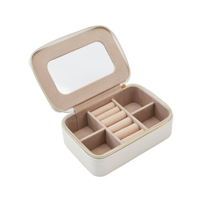 clear top Leah Travel Jewelry Case in pearl white unzipped showing multiple compartments inside