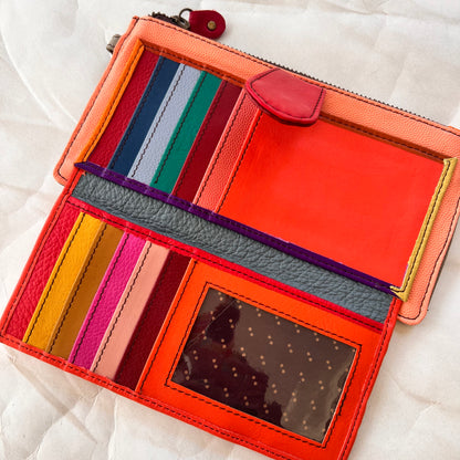 interior view of kimber wallet showing colorful card slots, pockets, and clear spot for ID.