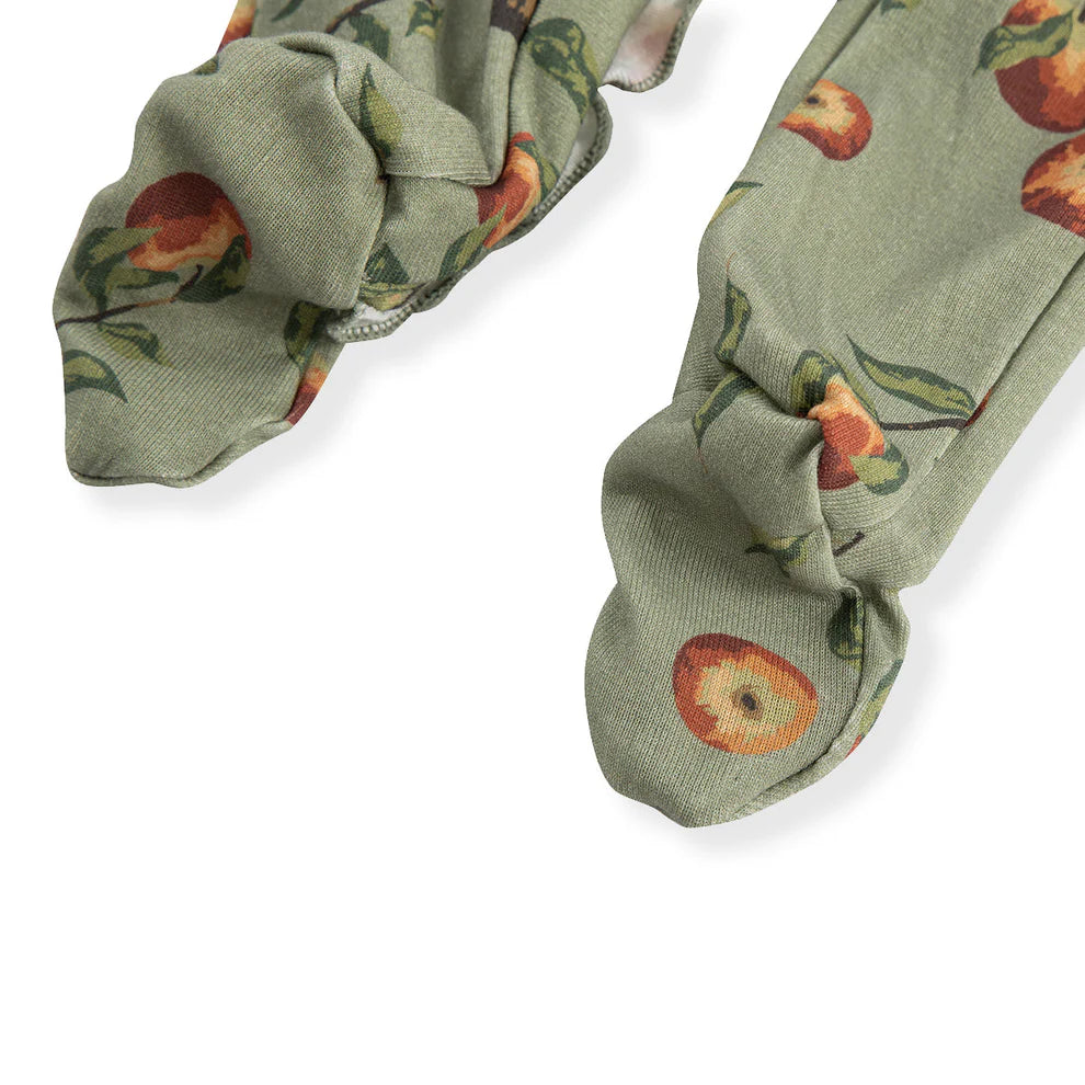 close-up of feet on Apple Orchard romper