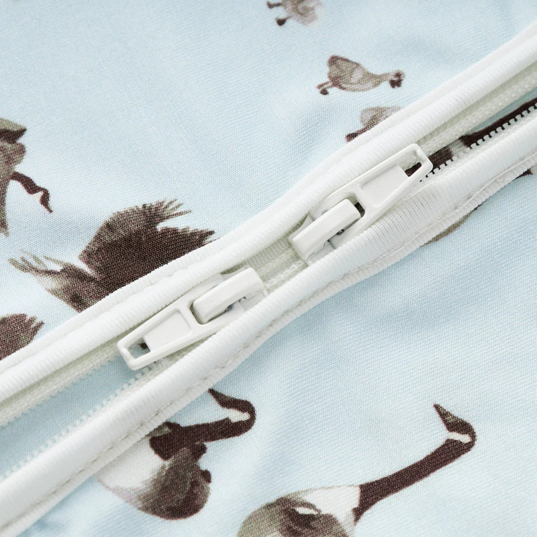 close-up of two way zipper on goose romper