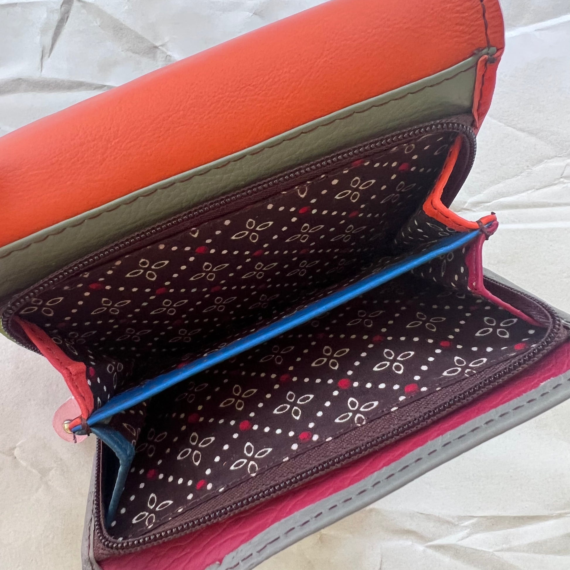interior view of cranberry rings wallet' zipper pocket