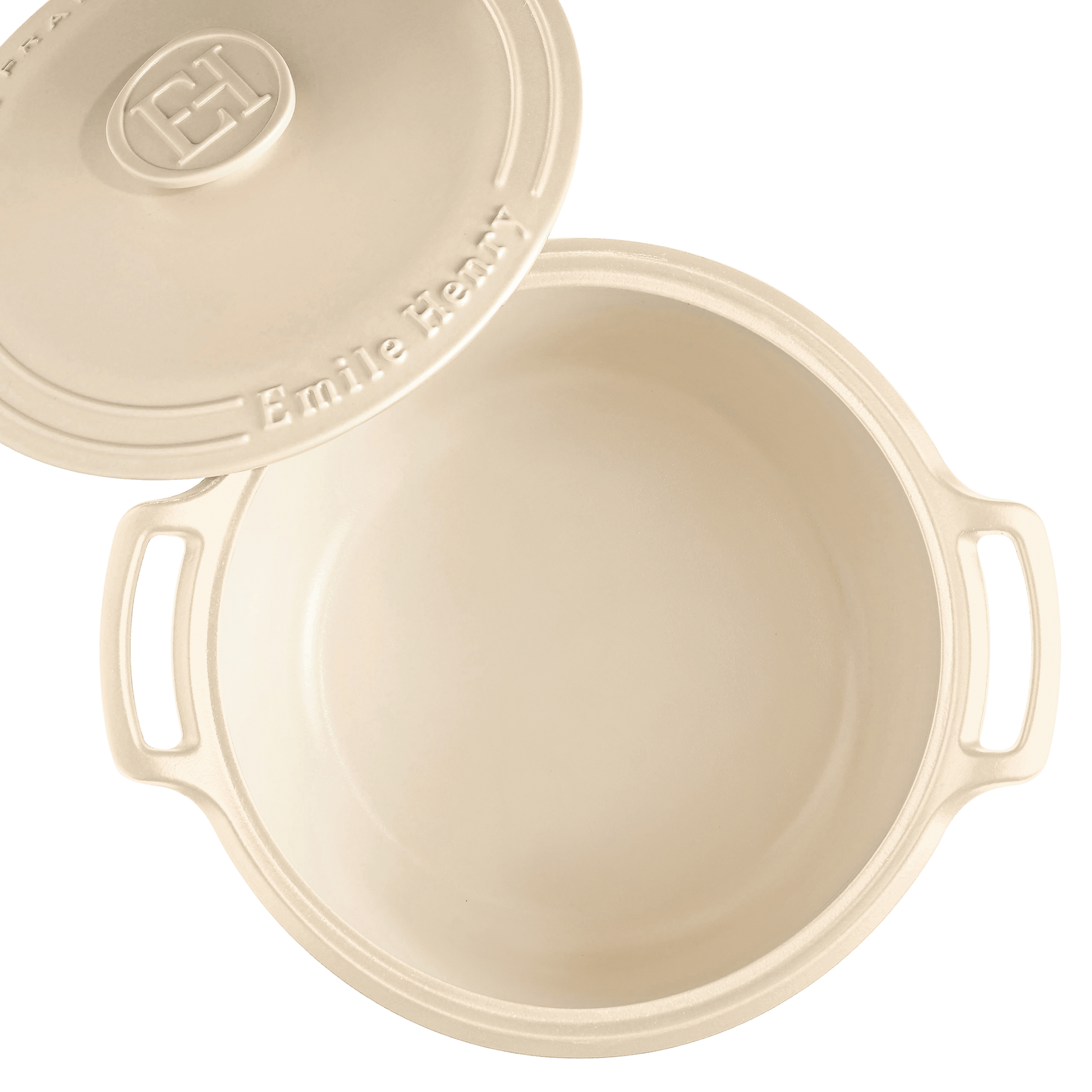 cream colored Sublime Dutch Oven with lid set to the side.