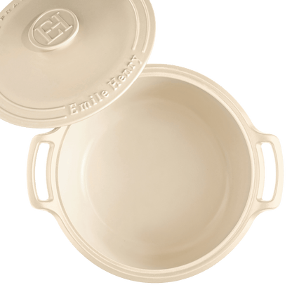 cream colored Sublime Dutch Oven with lid set to the side.