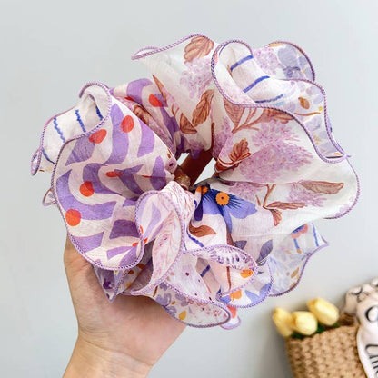 purple patchwork scrunchie on a white background