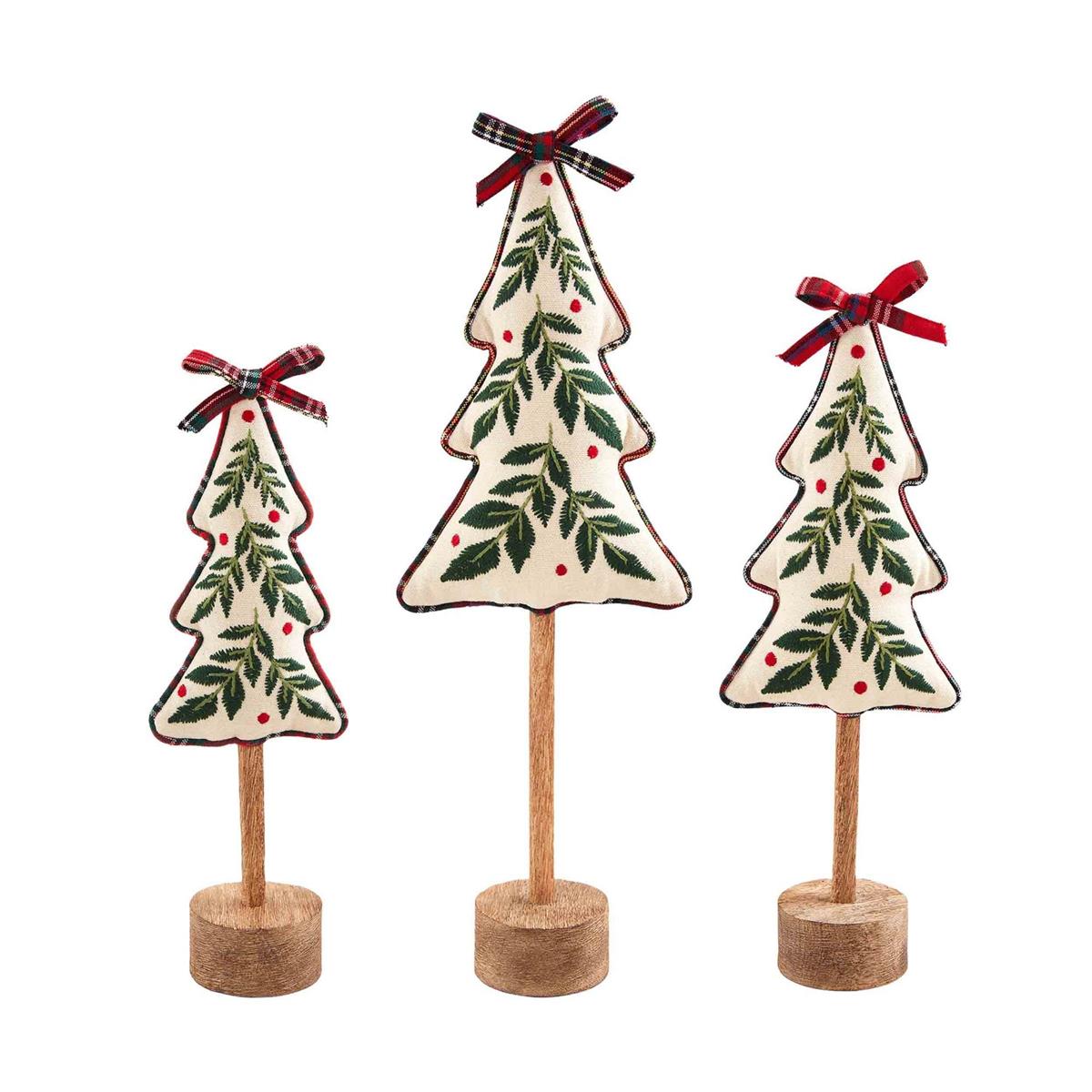 all three sizes of embroidered holly tree sitters displayed against a white background
