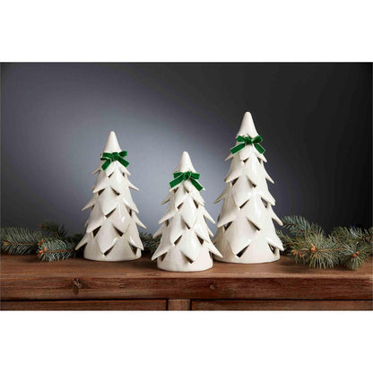 all three sizes of christmas tree with green bow sitters displayed on a wooden hall table next to pine swag