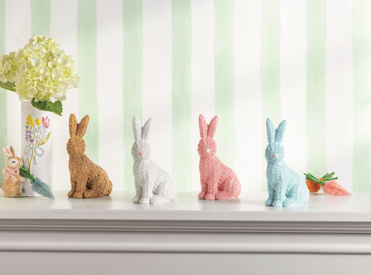 assorted bunnies on a shelf with flowers