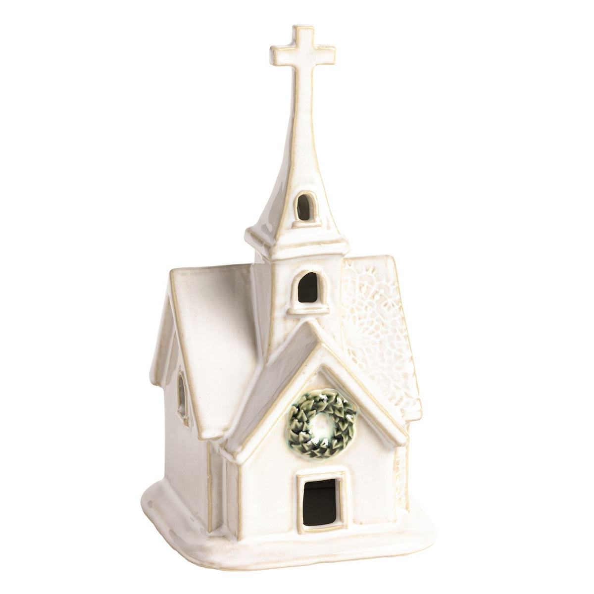 small white ceramic church with pressed lace details, wreath over the door, and a tall cross steeple
