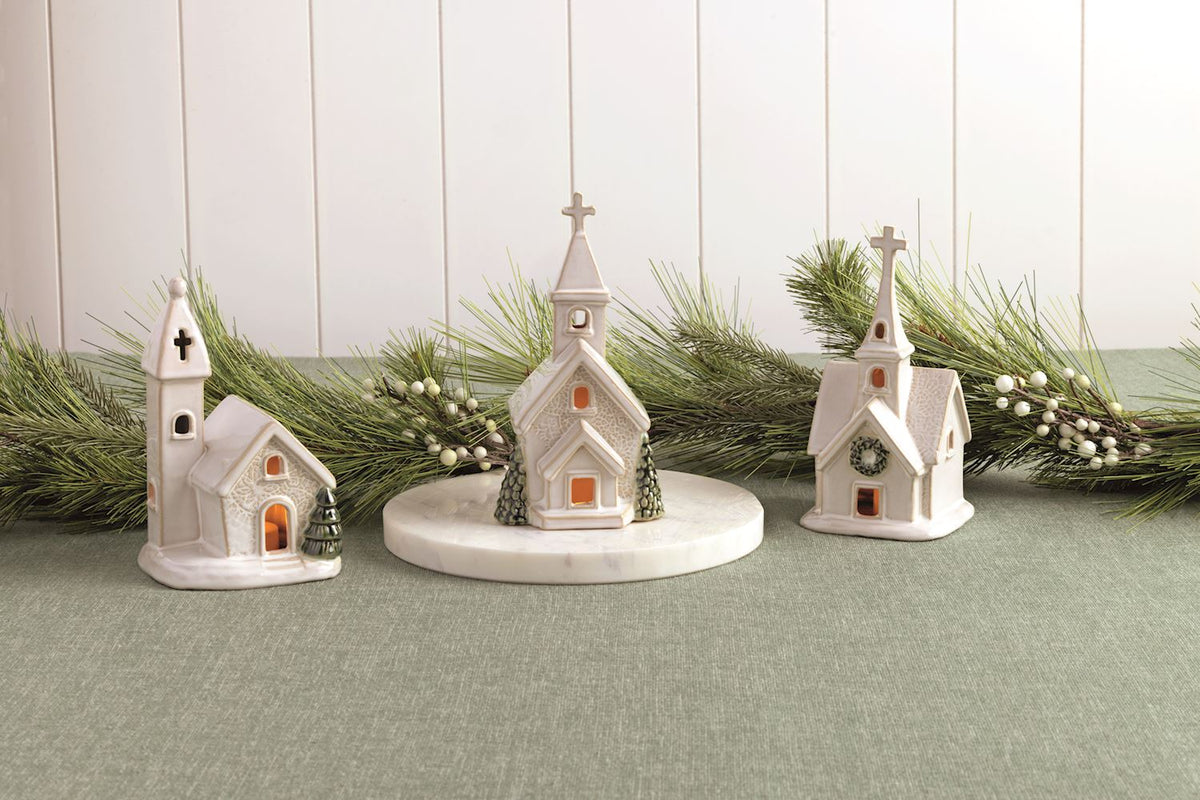 3 church sitters on decorated table