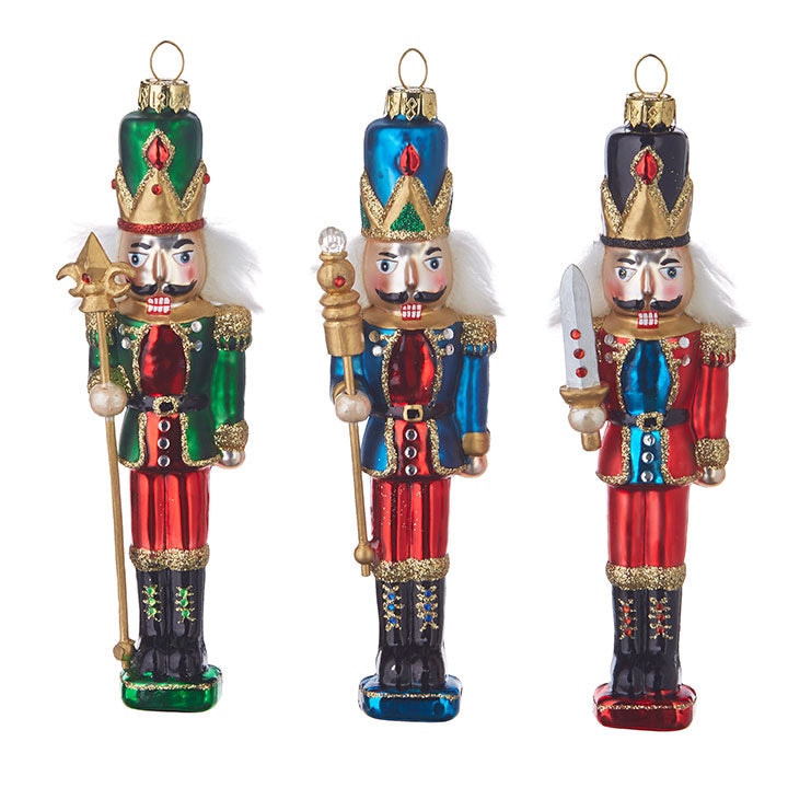 all three colors of nutcracker ornaments displayed on a white background