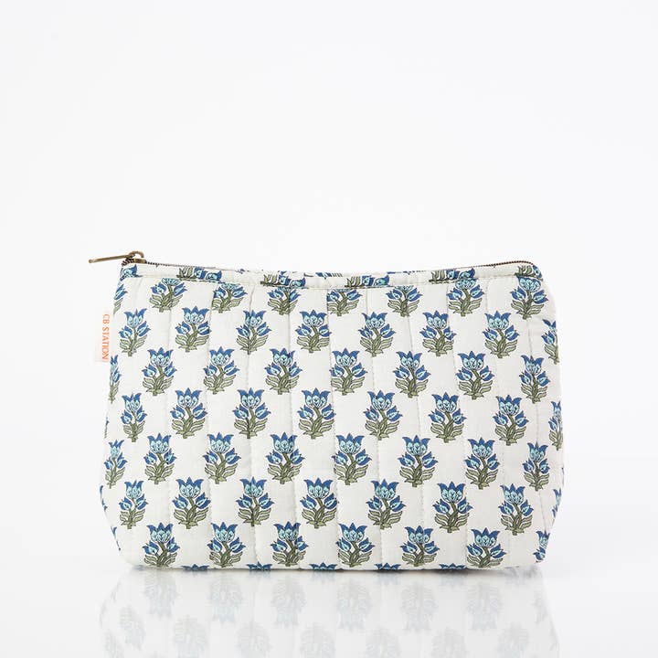front view of white zipper bag with aqua floral block print design