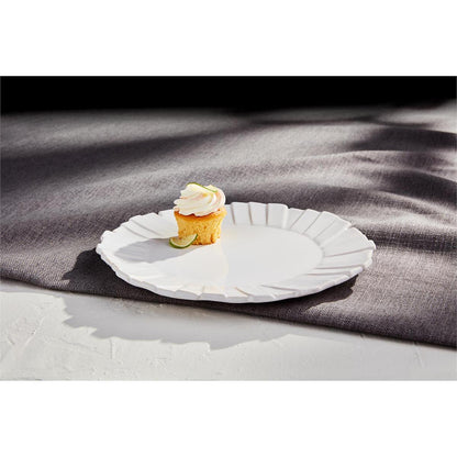 layered rim platter with a cupcake on it on a table with a grey tablecloth
