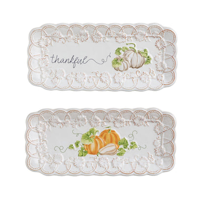 Two decorative trays with pumpkin designs one is printed with 'thankful' text
