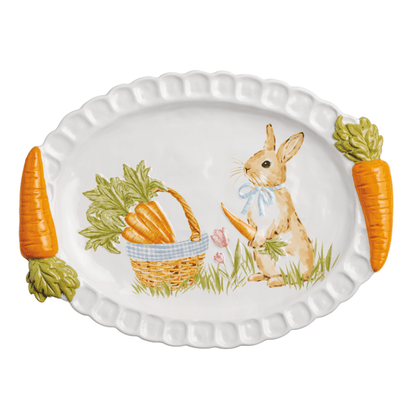 Decorative platter with a rabbit and carrot design on a white background