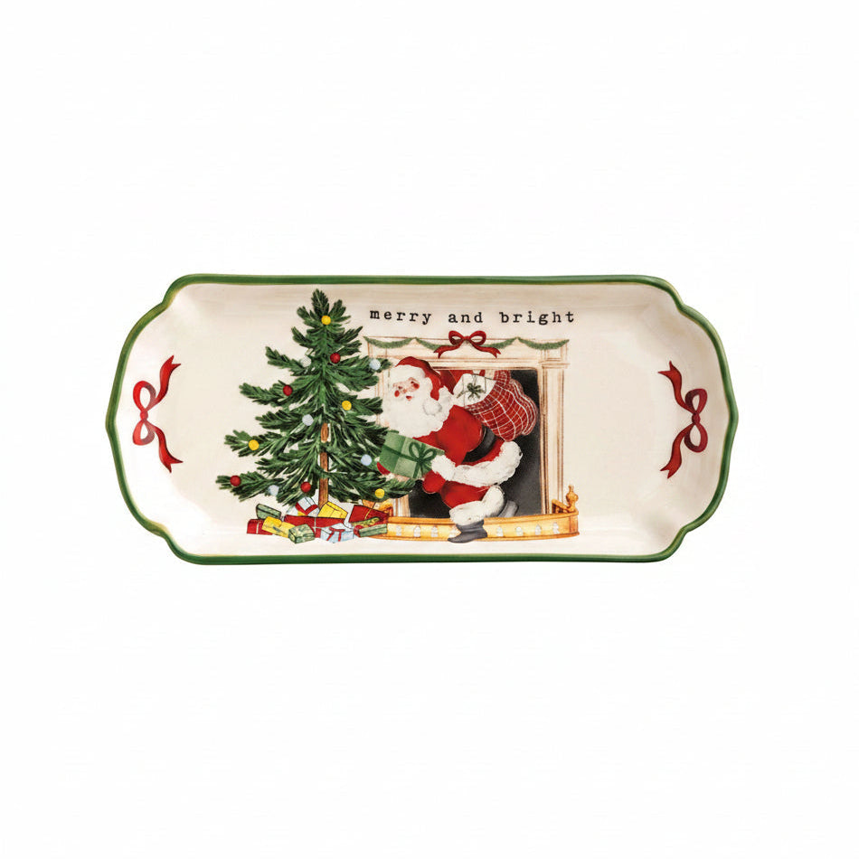 tray with the image of santa coming out of a fireplace next to a tree and 'merry and bright' printed across the top