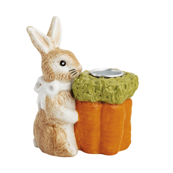 Ceramic rabbit with a carrot-shaped taper holder on a white background