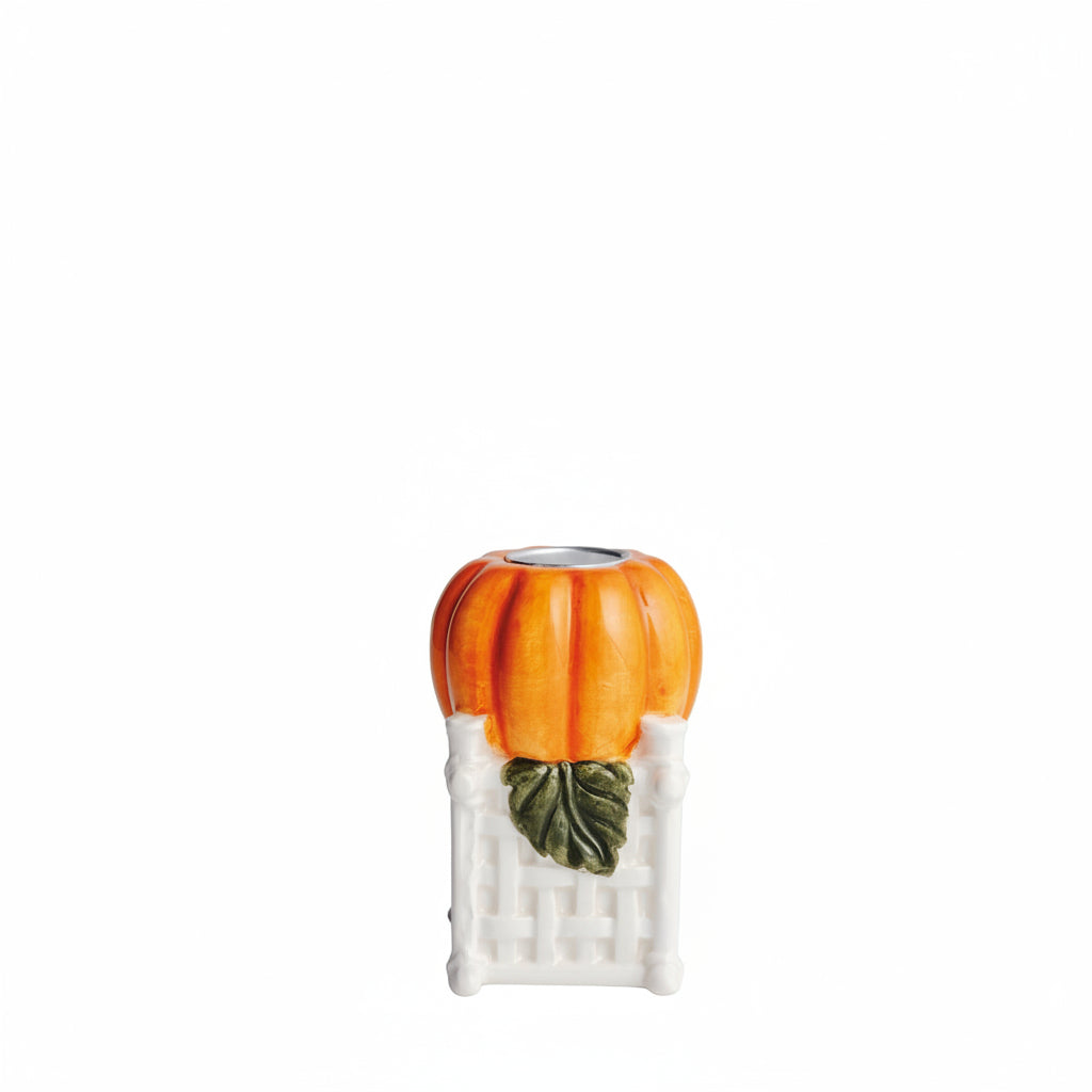 small single orange pumpkin candle holder on a white background
