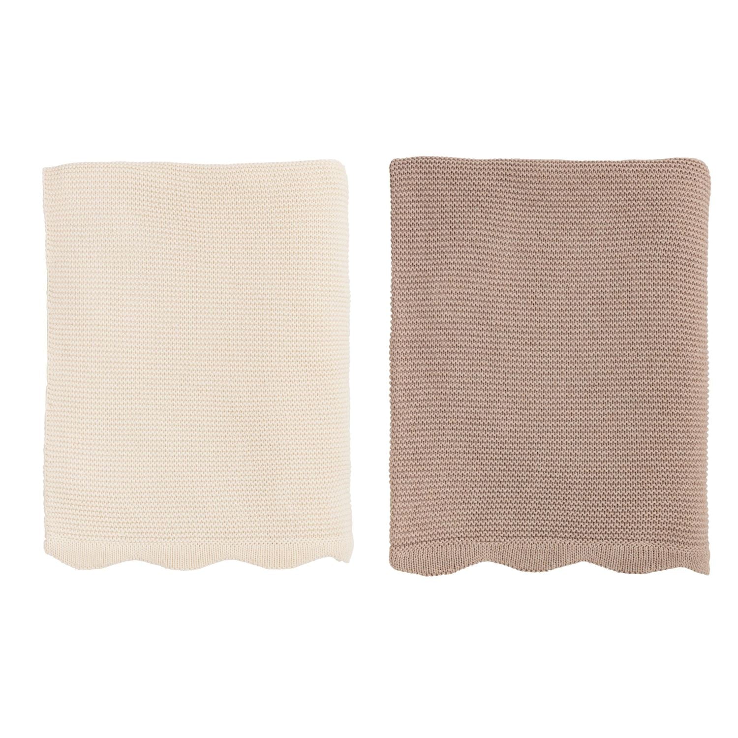 Two knitted blankets, one beige and one brown, folded on a white background