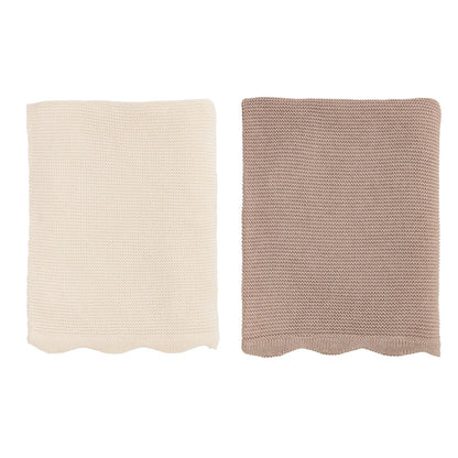 Two knitted blankets, one beige and one brown, folded on a white background