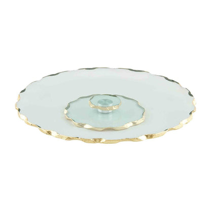 glass and gold lazy Susan shown on a white background.