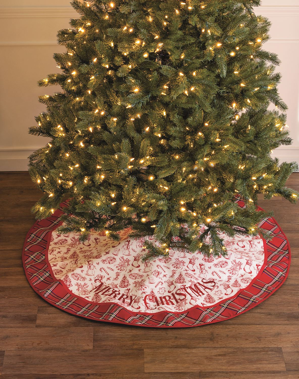 Toile Tree Skirt draped around a christmas tree