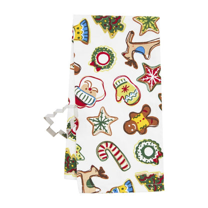 white towel with christmas cookie design and a tree shaped cookie cutter set next to it.