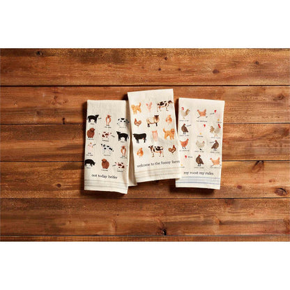 3 styles of farm animal towels on a wooden slat background.