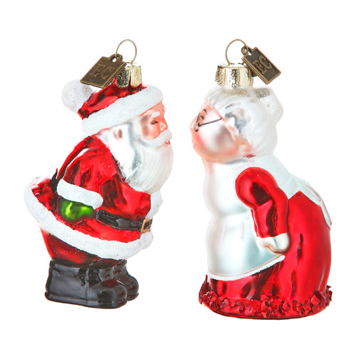 mr and mrs claus glass ornaments facing each other on a white background.