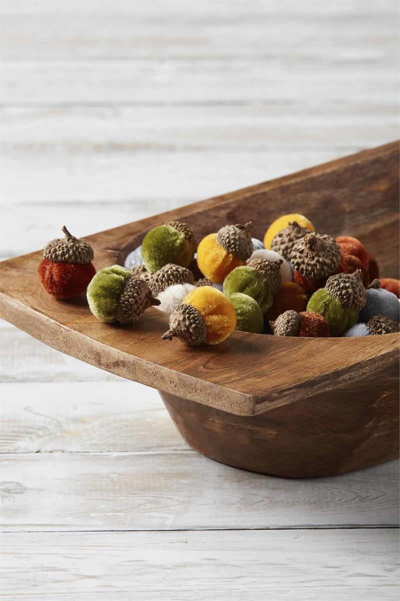 wooden bowl filled with velvet acorns.