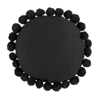black velvet pillow with pom trim on a white background.