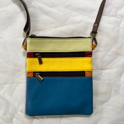 maya bag with crossbody strap attached.