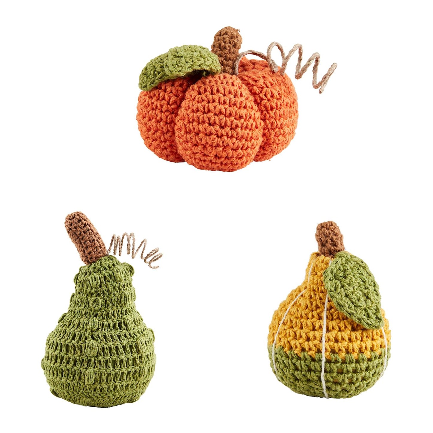 assorted crochet pumpkins and gourds arranged on a white background.