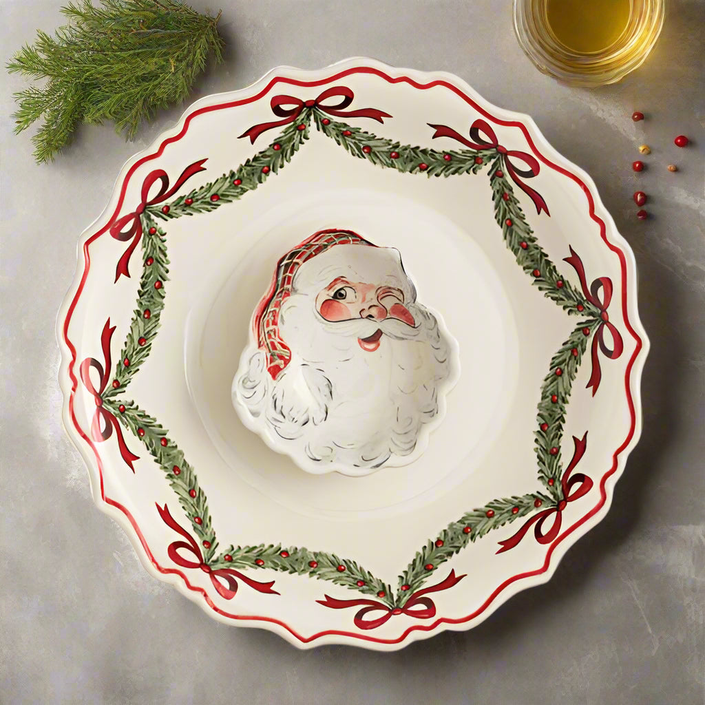 Santa Chip & Dip Bowl on a countertop with herbs and spices
