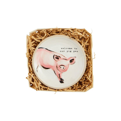 tidbit plate with image of a pig and "welcome to our pig pen" printed on it.