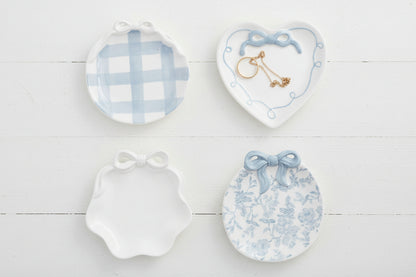 4 light blue and white colored bow ring dishes