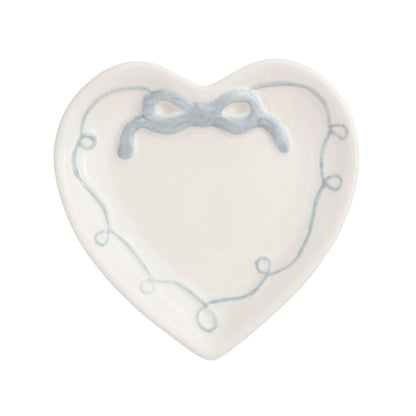 white ceramic heart dish with blue bow on top