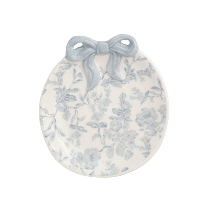round ceramic dish with blue toile design and bow on top