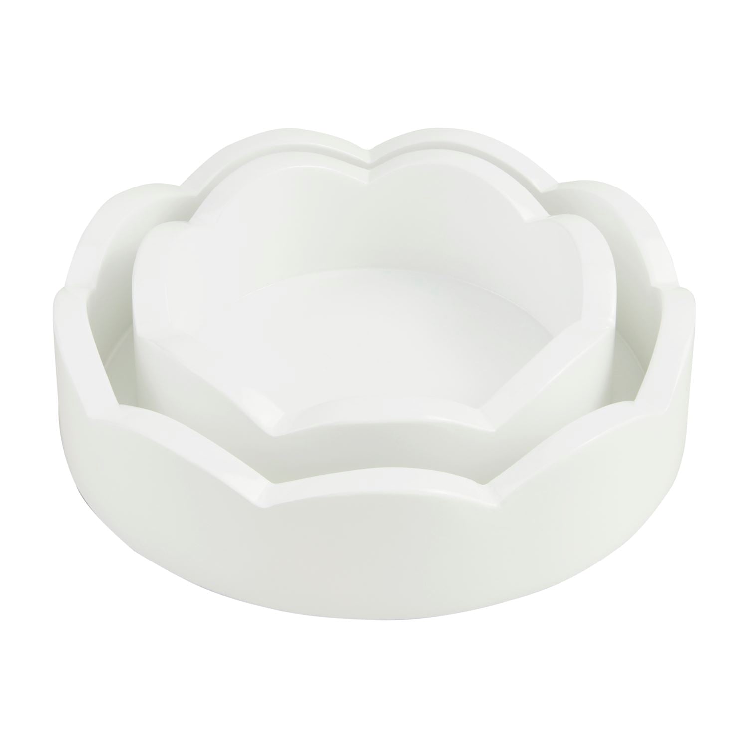 Two sizes of round white scalloped edge trays nested together.