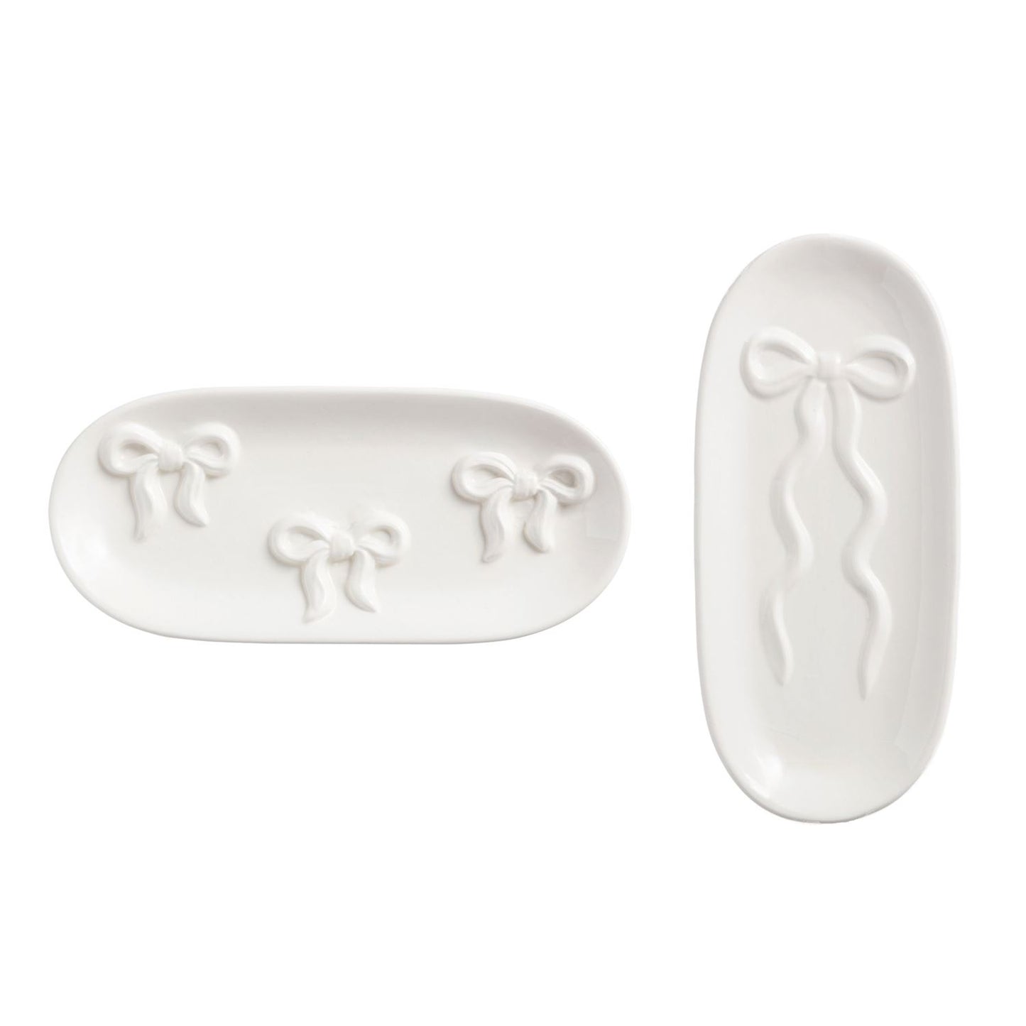 Two white ceramic trays with bow designs on a white background