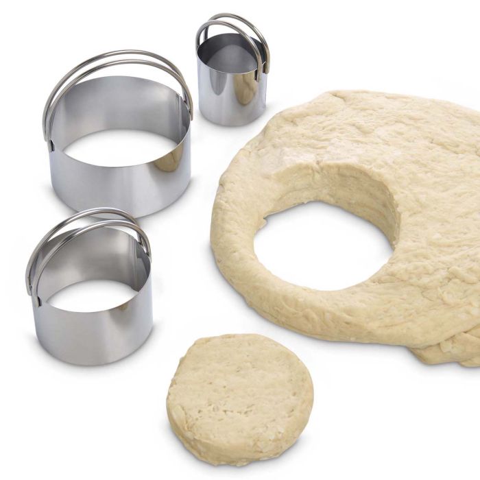 3 sizes of cutters with biscuit dough